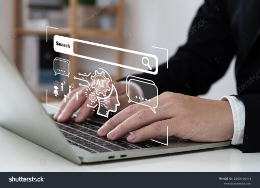man typing on laptop