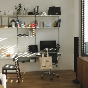 Modern home office setup featuring ergonomic furniture and efficient shelving, illustrating professional office furniture installation for a functional and stylish workspace