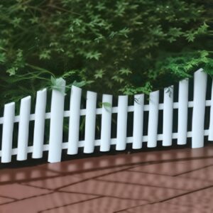 Garden fencing products displayed by professional manufacturers, including wooden panels, metal fences, and vinyl designs in an outdoor showroom