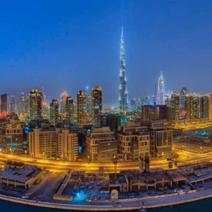 Dubai skyline at night featuring Burj Khalifa illuminated with city lights and highways